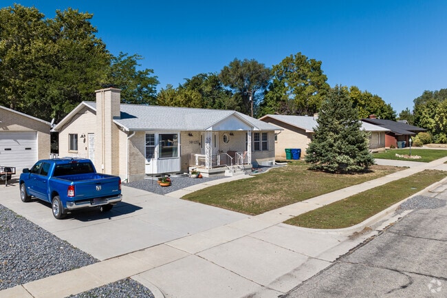 Both this Canyon Road home and attached garage are made of white brick.