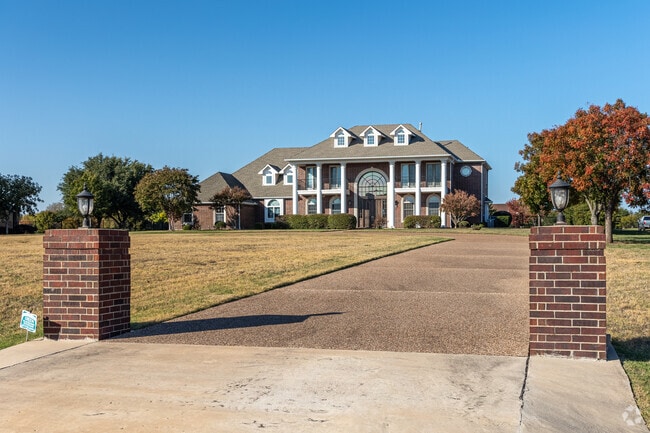 Large Colonial-style homes stand proudly in Parker, blending traditional charm with modern comfort.