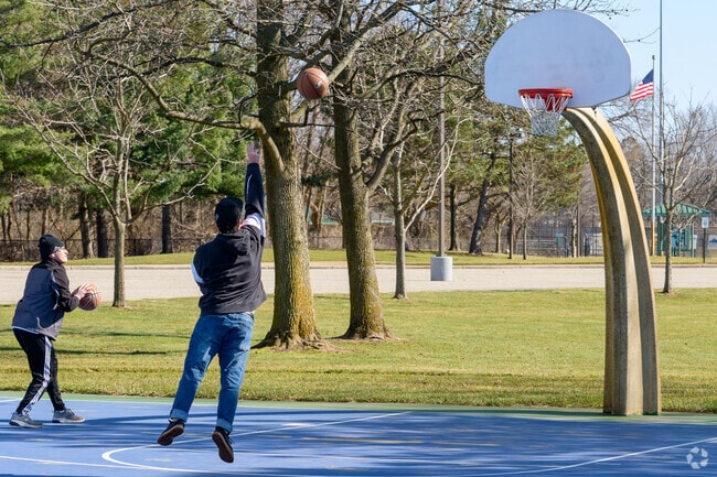 A couple of friends play basketball at the Matt Urban Recreational Complex in Maplewood.