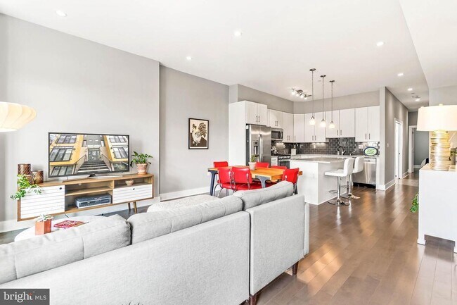 Open floor plan, showing views from the windows of the living room, facing the kitchen.
