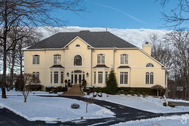 This is an example of a French Eclectic Asymmetrical style home in Anchorage.