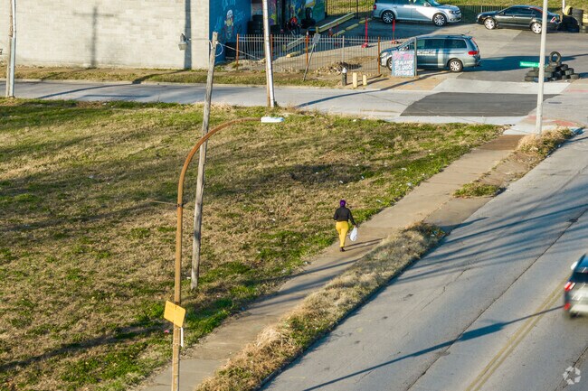 A woman walks along the sidewalk on a cool winter day in Wells/Goodfellow.