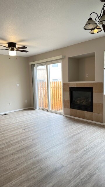 Living room showing gas log fireplace and LVP flooring