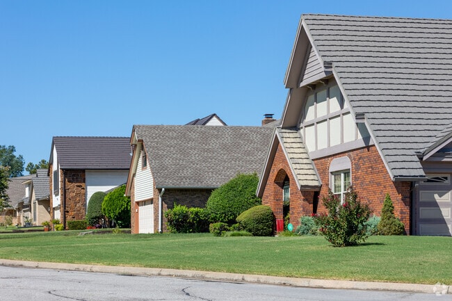 Cozy neighborhood streets lined with  homes in Shadow Mountain