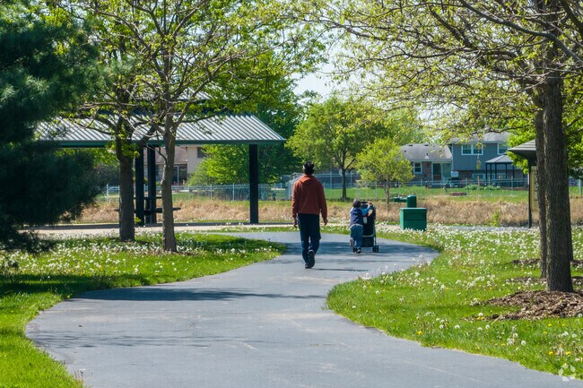 Armor Park walkway leads to the park playground and Newfield Park amenities.