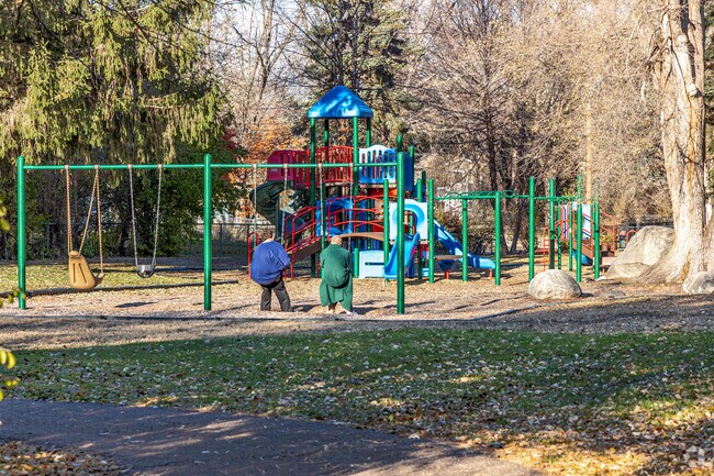 Visitors of all ages enjoy the swings at Sandcastle Park.