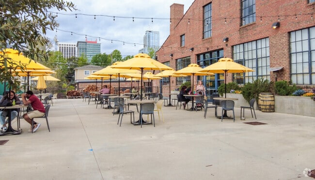 Sit outdoors at Transfer Food Hall, a short walk from the Garner Road neighborhood.