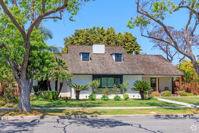 A modern take on Prairie style is framed by mature trees in Park Estates.