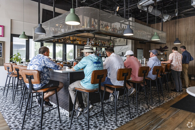Windermere residents enjoy dining at the bar at the neighborhood favorite, Rusteak.