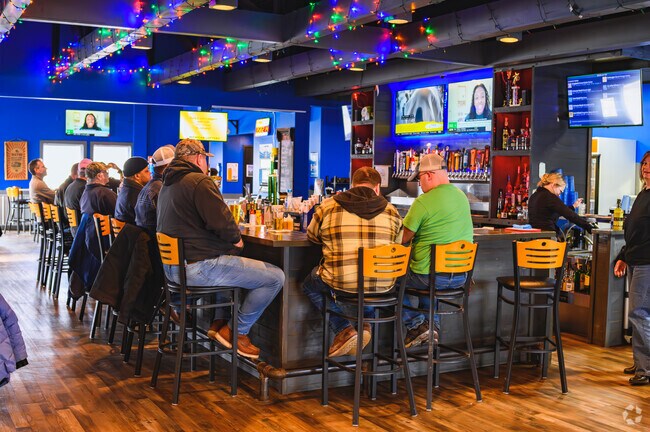 Friends gather for a beverage and good conversation at Holt's Gravity Smokehouse Brew & Que.