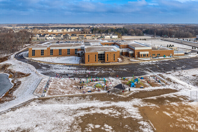 Sunrise Elementary School features a large playground and green space behind the school.