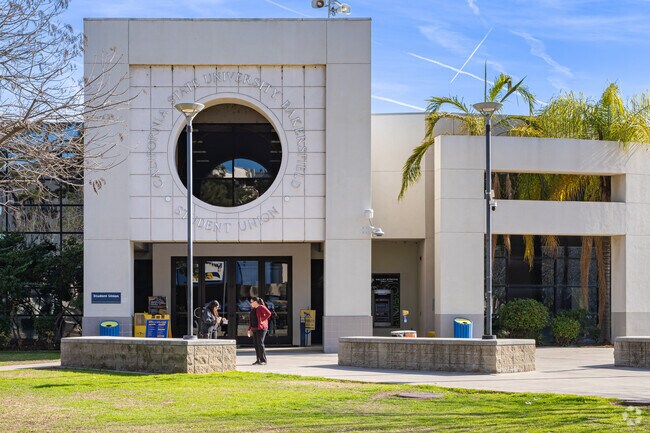 Two Brighton students hang out in front of the student union at CSU Bakersfield.