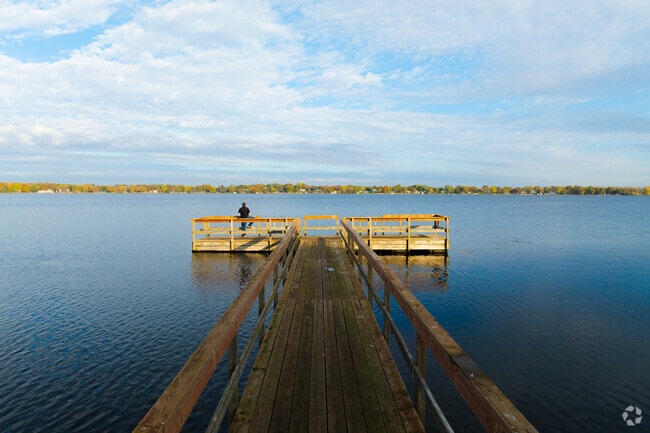 Anglers cast lines from the pier at Pleasant Lake in Annandale.