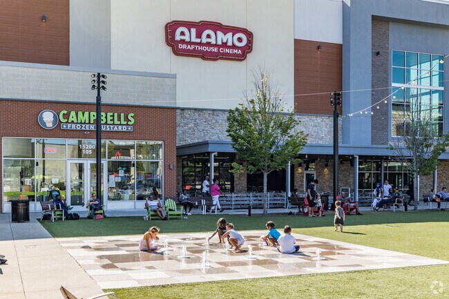 Families gather at the interactive fountain in Stonebridge at Potomac Town Center.