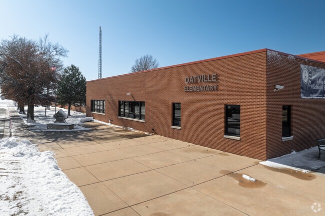 The building for Oatville Elementary School is made of red brick.