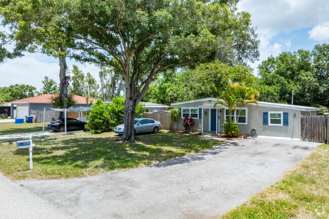 Mature trees offer cool shade for homeowners in Village Green.