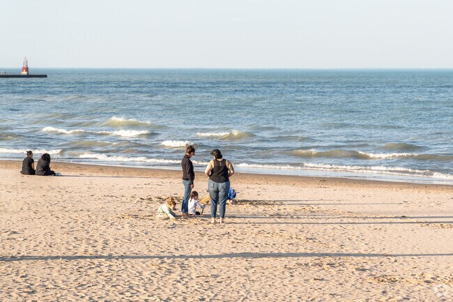 Families love playing in the sand at Foster Beach in Edgewater.