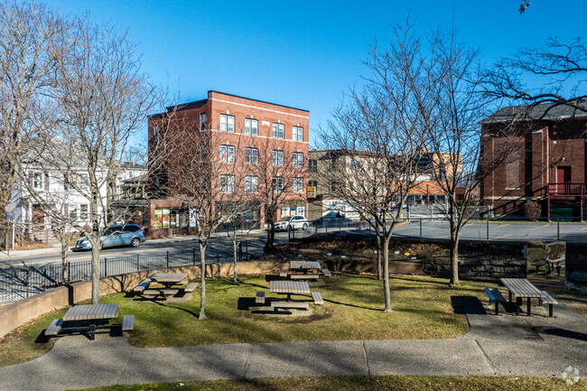 Pleasant & Wilson Park in Crown Hill-Piedmont, MA, features beautiful picnic tables for outdoor activities.