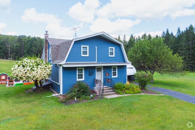 Colorful homes in Foster sit on spacious lots with long driveways that can accommodate RVs.