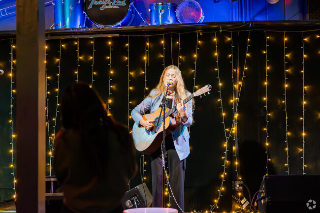 Rivercrest comes alive at night with live music, creating a vibrant community atmosphere.