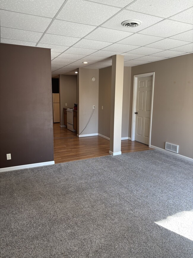 Livingroom looking to Kitchen & Bedroom 1 door