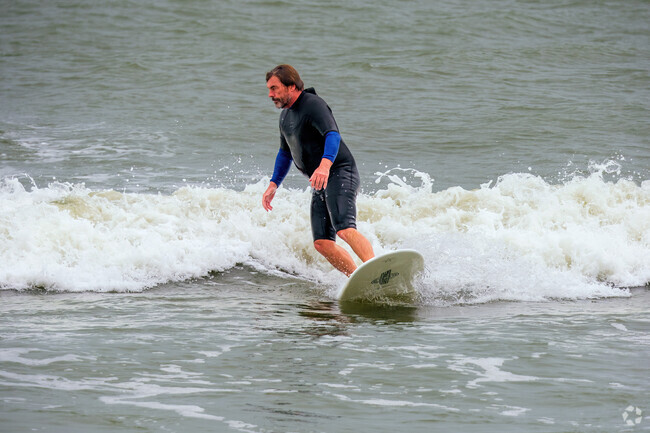 Locals and tourists alike enjoy surfing the waves at Cocoa Beach in Cape Canaveral.