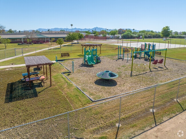 Students flock to the playground during recess at Moya Elementary School.