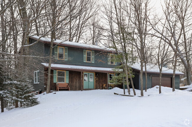 Colonial Homes in Marquette are often on large lots and surrounded by trees.
