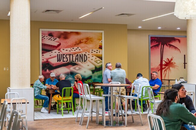 Play dominos with friends at Westland Mall while living in Virginia Gardens, FL.