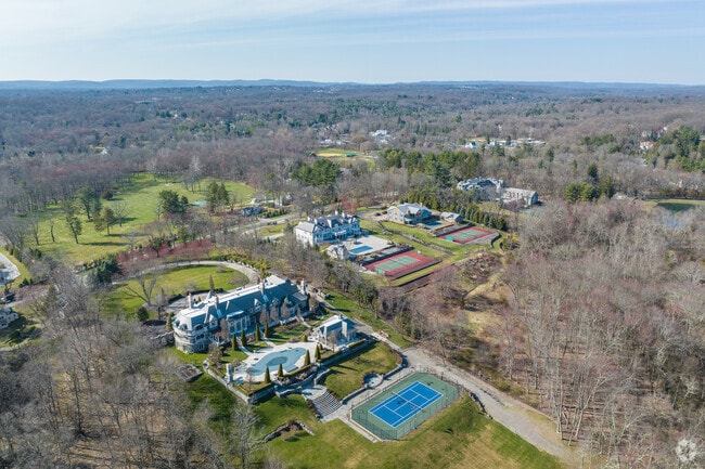 Many Saddle River estates include private tennis courts on gated grounds.