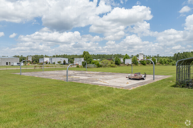 Alee Academy Charter High School has a PE area and field.