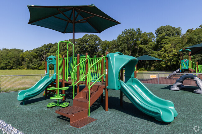 There are a few playground areas for the kids to play at Ashbrook Elementary School.
