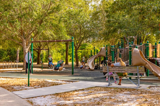 Shadow Bay Park features a large, shaded playground where families can gather and play.