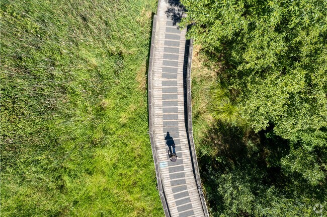 Take a nice walk around Rock Creek Trail wooded pathway.