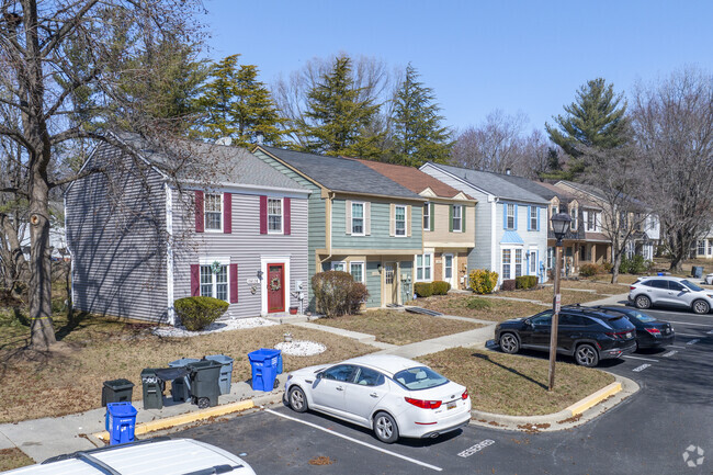 The colorful two-story townhomes lining the streets of Enfield Chase have small yards and tons of charm.