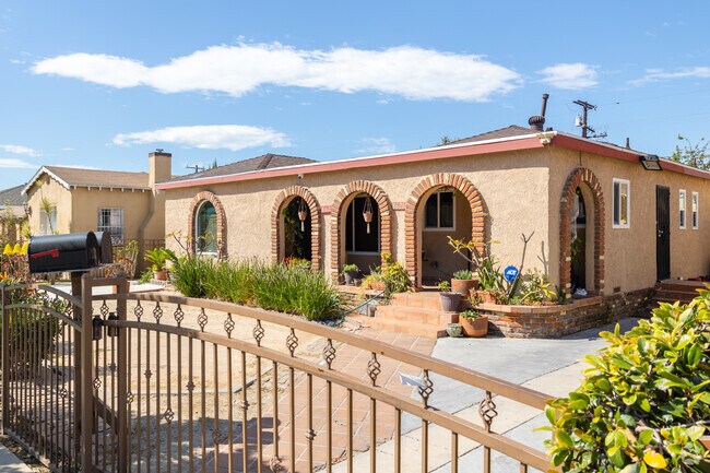 Find stuccoed homes with brick arches in South Gate, CA.