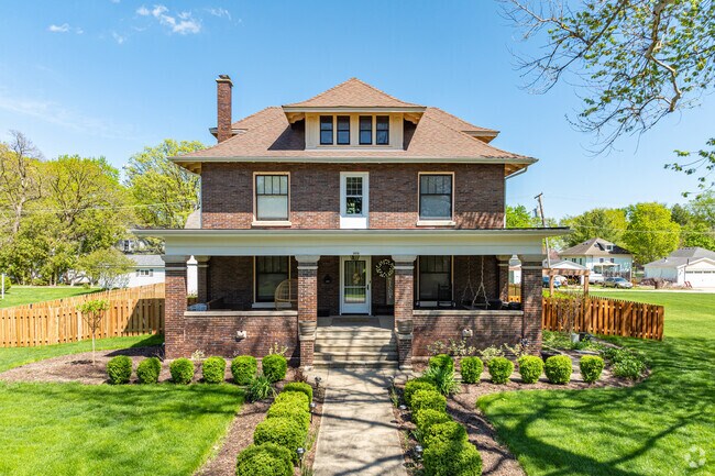 Brick American foursquare style home with large front porch located in Big Rock.