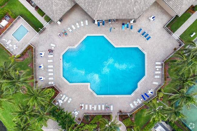 Relax by the clubhouse pool in Oakton Lakes for a perfect afternoon.