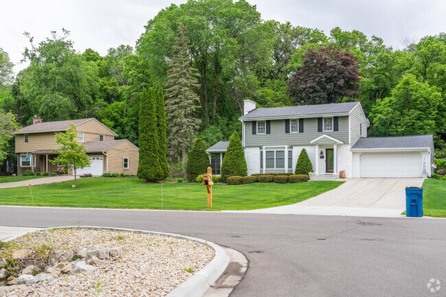 Groveland neighborhood features classic midcentury homes priced from the high 300,000s to mid-700,000s, with spacious lots ranging from a quarter to a full acre surrounded by towering trees.
