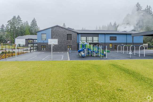 Playground area including basketball courts at Artondale Elementary School.