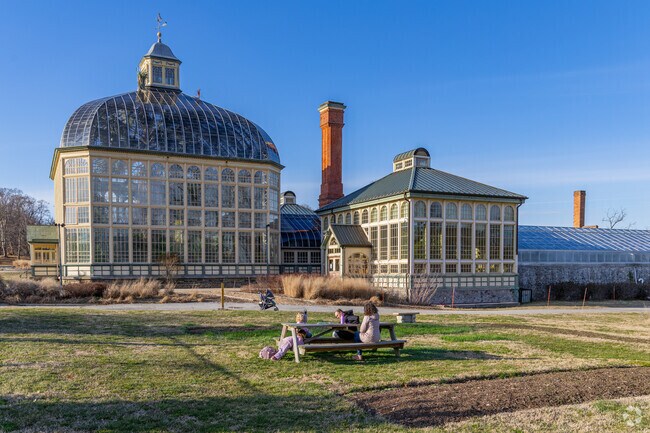 There are green space and benches for locals to enjoy the space at Rawlings Conservatory.