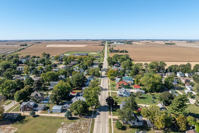 Ashton’s village center is framed by tree-lined roads and open farmland.