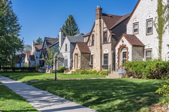 Rows of Tudor-Style homes along a neighborhood street in Highland Park.