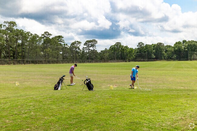 Hillsdale golfers practice their swing at Azalea Golf Course.