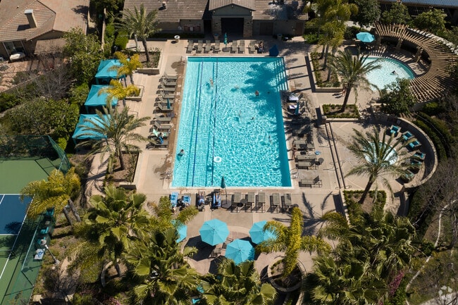 Residents of The Foothills can sit in a cabana or lounge in the sun at the poolside in Carlsbad.