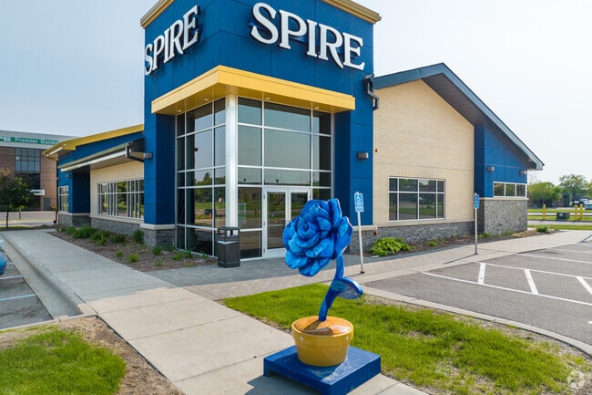 Spire in Hamline has 1 of 20 seven-foot-tall rose statues custom designed for Roseville.