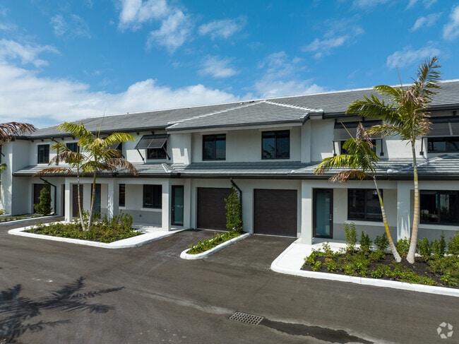 Condominiums in Miami's Amelia District feature attached garages.