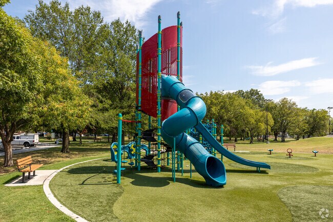 Joy and laughter abound at McClough Park's playset, a vibrant spot in Tulsa.