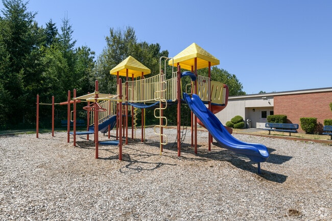 Upper side of the playground with lots of fun activities at St. John Fisher School.