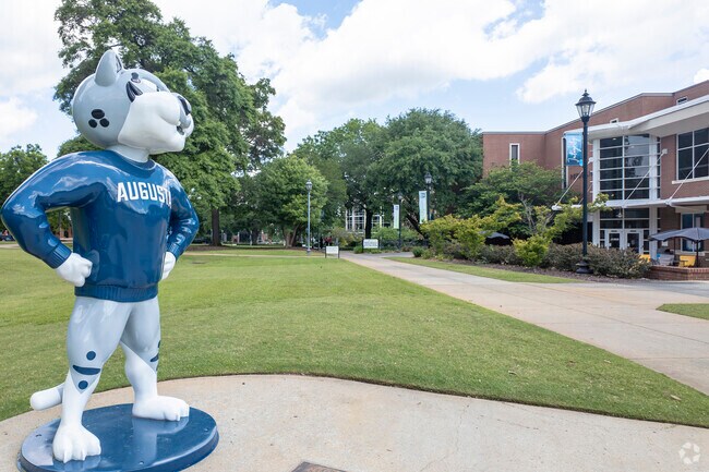 The magnolia trees frame the Augusta University Jaguar statue on campus.